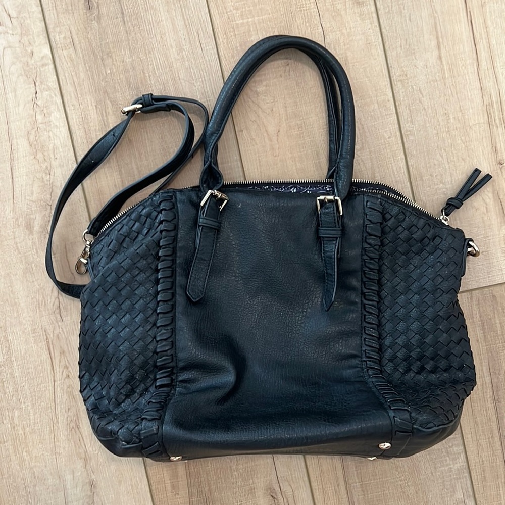 Black woven oversized bag with long strap and short handles